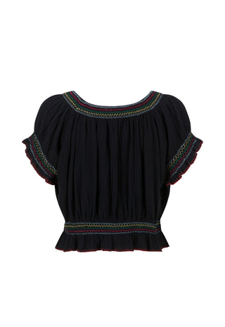 a-black-short-sleeve-blouse-with-colorful-embroidered-trim-around-the-neckline-and-sleeve-cuffs-and-a-smocked-ruffled-hem-shown-against-a-plain-white-background