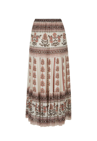 a-bohemian-style-pleated-maxi-skirt-with-a-cream-base-and-brown-terracotta-and-black-floral-and-geometric-patterns-shown-against-a-plain-white-background