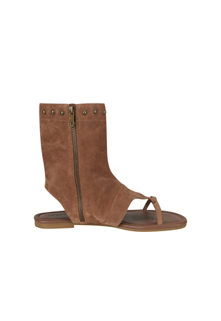a-brown-suede-ankle-sandal-with-a-side-zipper-decorative-metal-studs-and-a-toe-loop-shown-from-a-side-profile-on-a-white-background
